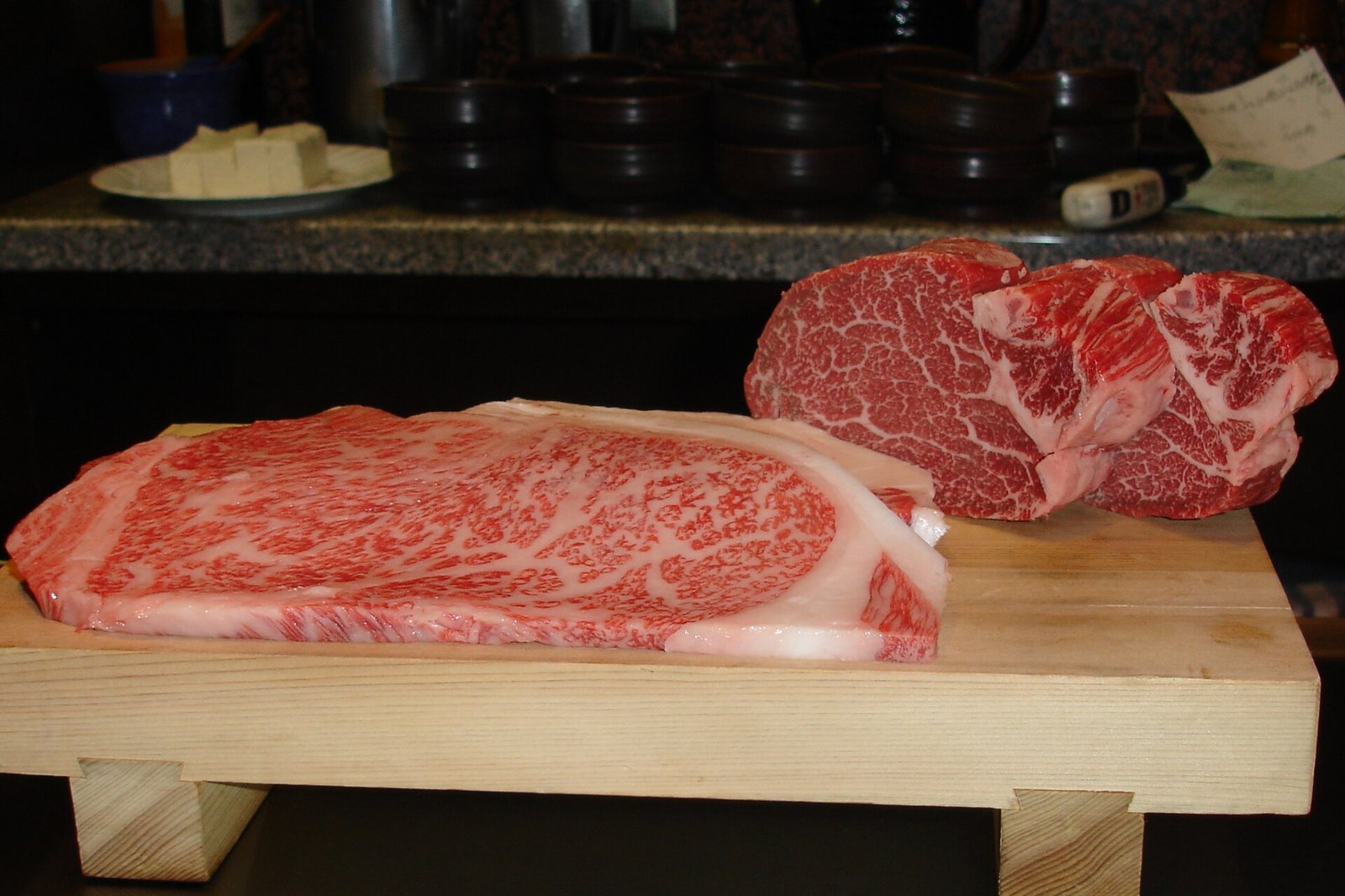 Marbled Kobe beef sirloin on a wooden board