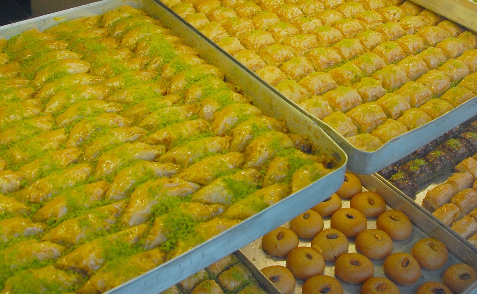 Trays of freshly cut pistachio baklava in a Turkish patisserie